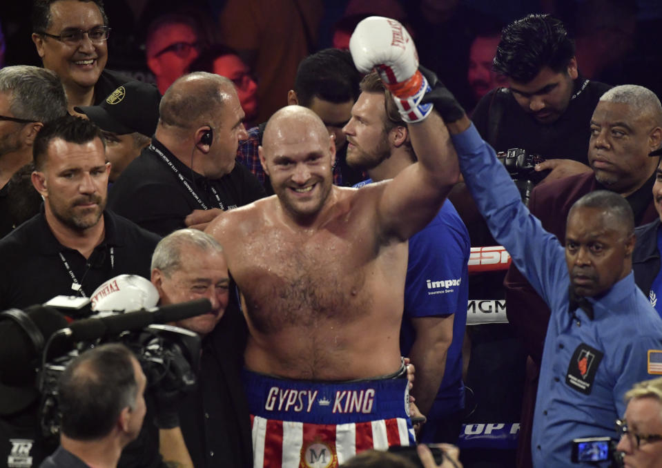 LAS VEGAS, NEVADA - JUNE 15: Tyson Fury(C) poses for the cameras after the fight was stop in the second round at MGM Grand Garden Arena on June 15, 2019 in Las Vegas, Nevada. Tyson Fury took the win by took the win by TKO. (Photo by MB Media/Getty Images)