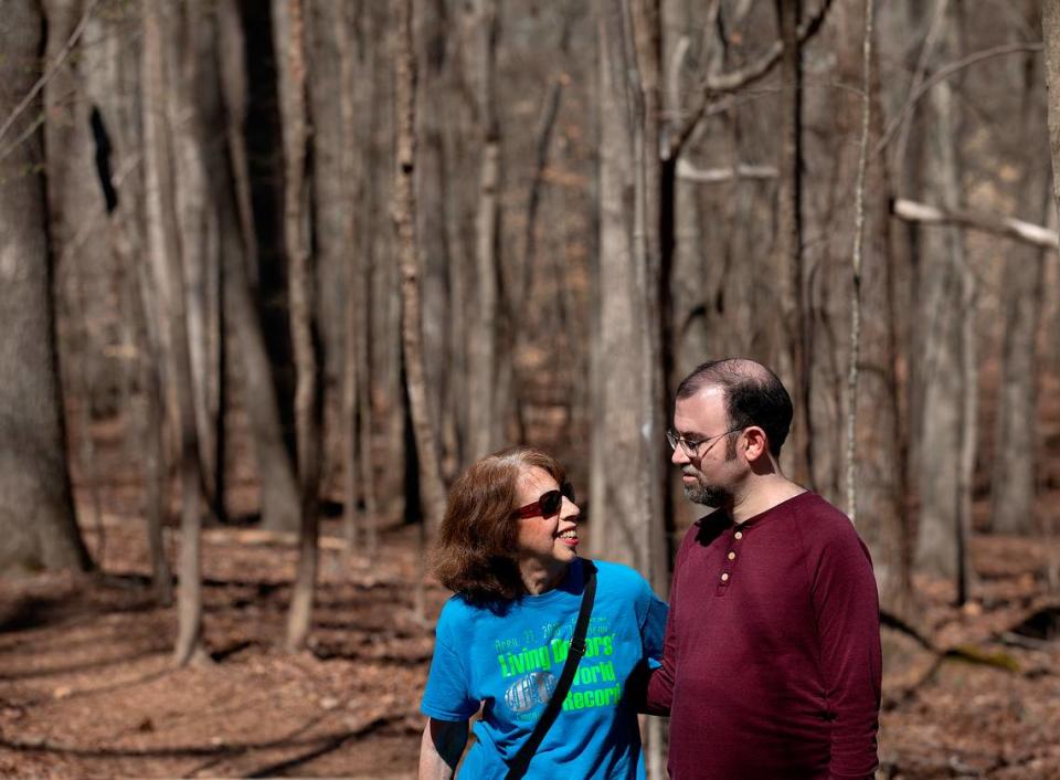 Carol Offen and her son, Paul Offen, pose for a portrait on a trail in the North Carolina Botanical Garden on Wednesday, March 13, 2024, in Chapel Hill, N.C. Carol, who gave Paul a kidney 17 years ago, now advocates for legislation that would offer better protections for live donors.