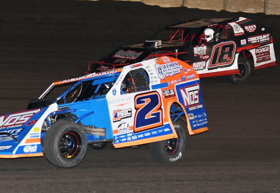 Nick Hoffman (2) turns back the challenge from Michael Long (18) in the early going of the 25-lap Summit Modified National race.