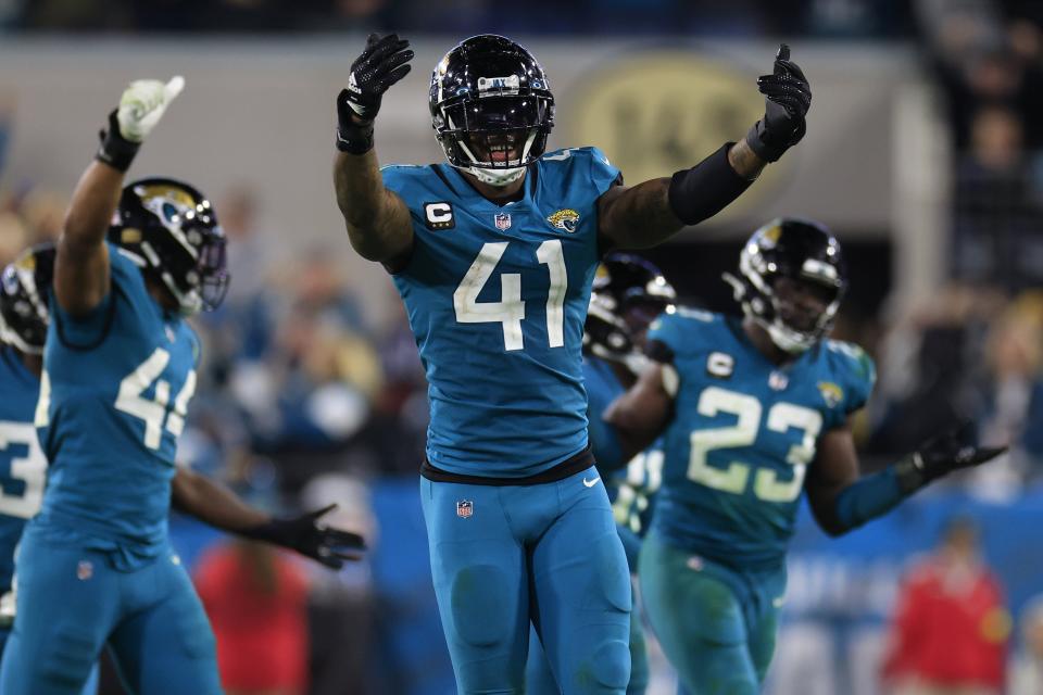 Jacksonville Jaguars linebacker Josh Allen (41) celebrates the last defensive stop for the Jaguars during the fourth quarter of an NFL football regular season matchup AFC South division title game Saturday, Jan. 7, 2023 at TIAA Bank Field in Jacksonville. The Jacksonville Jaguars held off the Tennessee Titans 20-16. [Corey Perrine/Florida Times-Union]