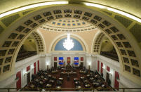 Judge Paul Farrell, top, presides over the Senate as House manager, John Shott, R-Mercer, front at podium, addresses the Senate during a pre-trial impeachment conference for four Supreme Court justices in the West Virginia State Senate chambers at the Capitol in Charleston, W.Va., Tuesday, Sept. 11, 2018. (AP Photo/Steve Helber)