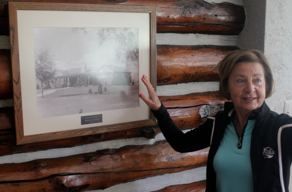 Kathy Aznavorian shows an old photograph of Fox Hills' original clubhouse built in the 1920s.
