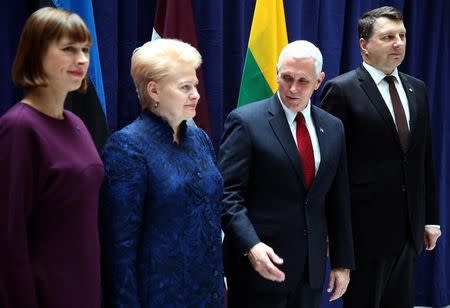 Estonia's President Kersti Kaljulaid, Lithuania's President Dalia Grybauskaite, U.S. Vice President Mike Pence and Latvia's President Raimonds Vejonis pose for a picture before their meeting at the 53rd Munich Security Conference in Munich, Germany, February 18, 2017. REUTERS/Michael Dalder