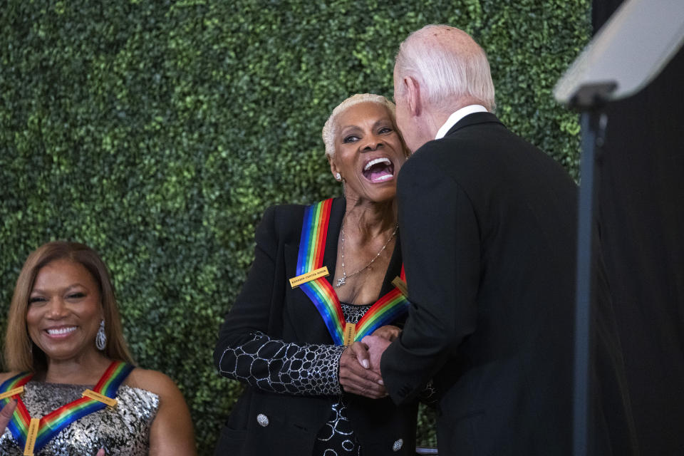 CORRECTS MONTH TO DECEMBER INSTEAD OF NOVEMBER - President Joe Biden gives 2023 Kennedy Center honoree Dionne Warwick a kiss during the Kennedy Center honorees reception in the East Room of the White House, Sunday, Dec. 3, 2023, in Washington. (AP Photo/Manuel Balce Ceneta)