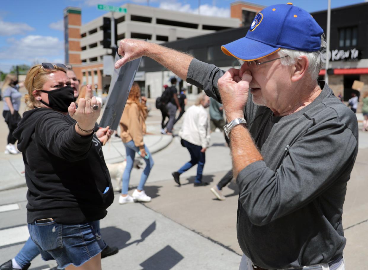 A passerby and protesters express opposing opinions during a Black Lives Matter march and rally in Appleton in 2020. Many researchers believe the level of anger in society has increased significantly in recent years.