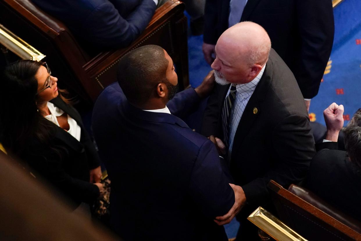 Hays County U.S. Rep. Chip Roy shakes hands Wednesday, right, with Rep. Byron Donalds, R-Fla., after the Texan nominated Donalds for House speaker before the fourth round of voting in the House. At left is Rep. Lauren Boebert, R-Colo.