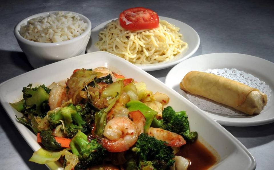 Spicy veggies with shrimp served with noodle salad, steamed rice and a vegetarian spring roll appetizer from Tokyo Alley. Telegraph file photo