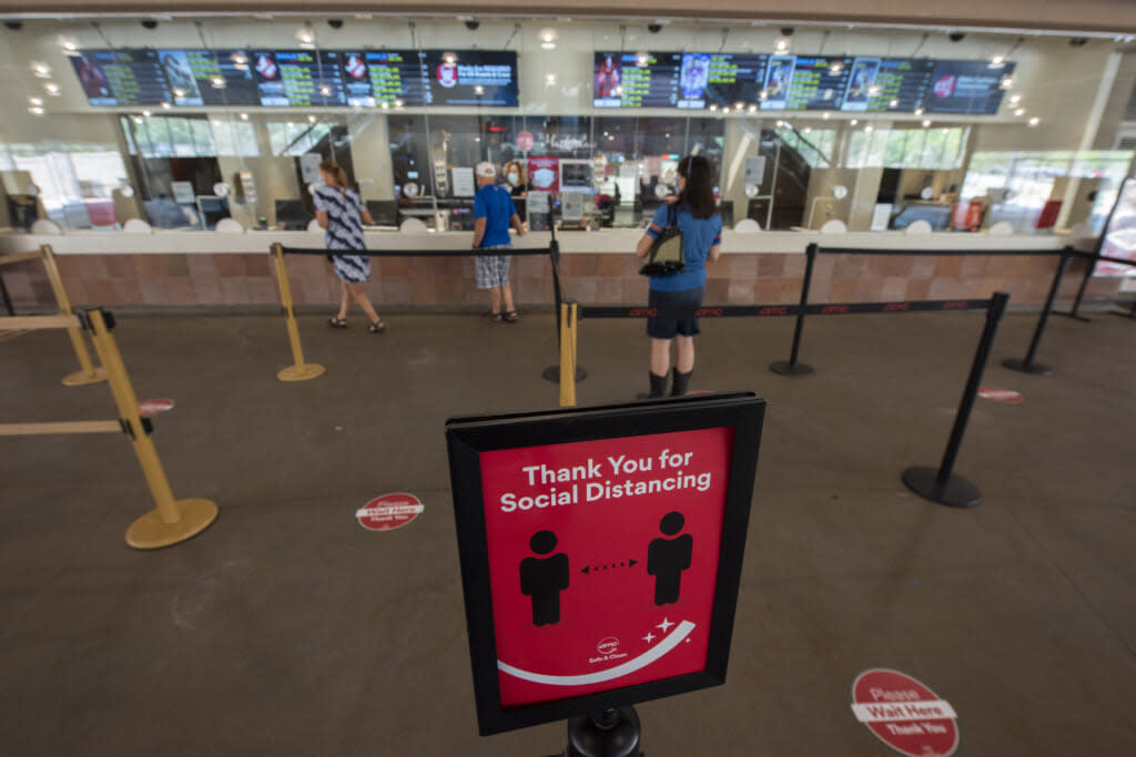 Movie goers social distance at the AMC Highlands Ranch 24 on August 20, 2020 in Highlands Ranch, Colorado. (Photo by Tom Cooper/Getty Images)