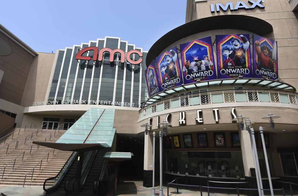 FILE - The currently closed AMC Burbank 16 movie theatres complex is pictured on April 29, 2020, in Burbank, Calif. After several false starts, the film industry is hoping to bring new releases back into movie theaters in late August. But for blockbusters, it may mean rethinking opening weekend and returning to a more gradual rollout through international and U.S. territories. Gone for now are the days of massive global openings. And theater owners say if they don't get new films soon, they may not make it to 2021. (AP Photo/Chris Pizzello, File)