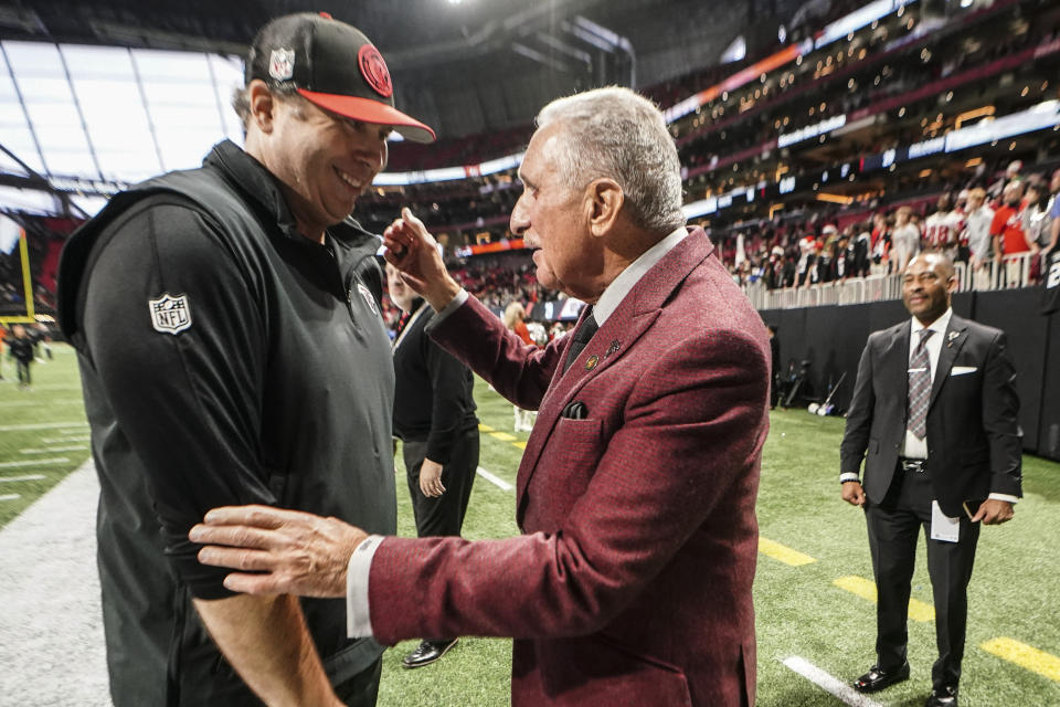 Atlanta Falcons head coach Arthur Smith speaks with Owner Arthur Blank after an NFL football game between the Atlanta Falcons and the Indianapolis Colts, Sunday, Dec. 24, 2023, in Atlanta. The Atlanta Falcons won 29-10. (AP Photo/John Bazemore)