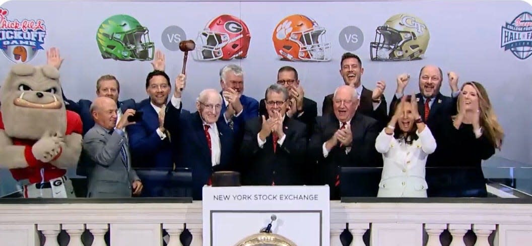 Former Georgia football coach Vince Dooley and UGA president Jere Morehead--second and third from left in front row--among those ringing the closing bell at the New York Stock Exchange on Thursday May 20, 2022.