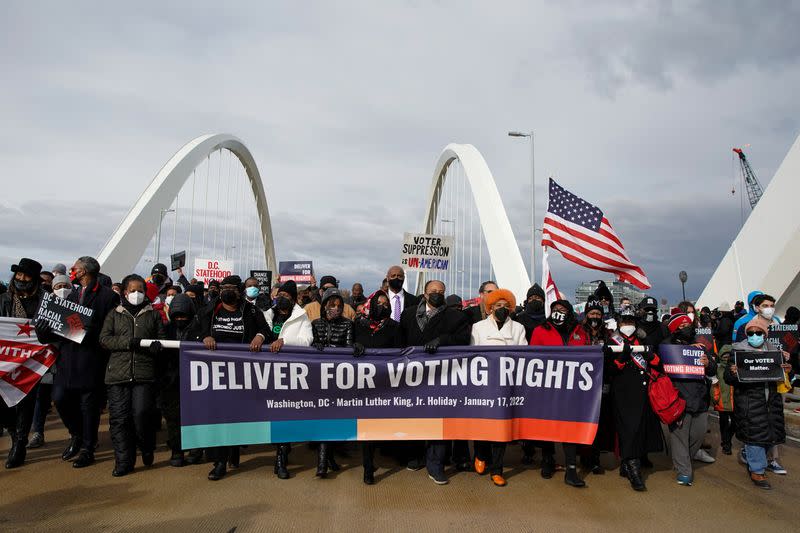 U.S. civil rights activists hold a Peace Walk on the Frederick Douglass Memorial Bridge, in Washington