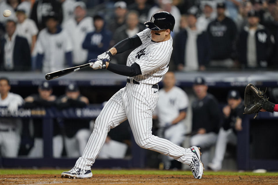 New York Yankees Anthony Rizzo connects for a two-run home run against the Cleveland Guardians during the sixth inning of Game 1 of an American League Division baseball series, Tuesday, Oct. 11, 2022, in New York. (AP Photo/John Minchillo)