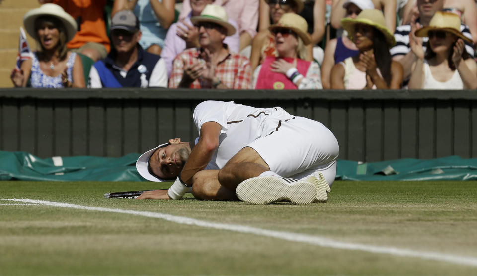 Serbia's Novak Djokovic on the floor in his match against Great Britain's Andy Murray in their Men's Final during day thirteen of the Wimbledon Championships at The All England Lawn Tennis and Croquet Club, Wimbledon.