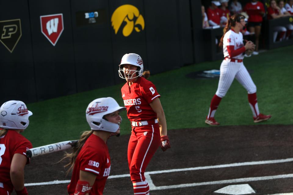 Whiteford graduate Aly VanBrandt celebrates after crossing home plate with a run for Indiana during the Big Ten softball tournament Friday, May 10, 2024 in Iowa City, Iowa.