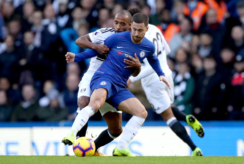 Chelsea’s Eden Hazard (front) is well marshalled by Fulham’s Denis Odoi