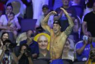 Caeleb Dressel reacts after winning the men's 100 freestyle during wave 2 of the U.S. Olympic Swim Trials on Thursday, June 17, 2021, in Omaha, Neb. (AP Photo/Charlie Neibergall)