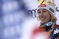 United States' Mikaela Shiffrin smiles on the podium after winning an alpine ski, women's World Cup giant slalom, in Kronplatz, Italy, Tuesday, Jan. 24, 2023. Shiffrin won a record 83rd World Cup race Tuesday. (AP Photo/Gabriele Facciotti)