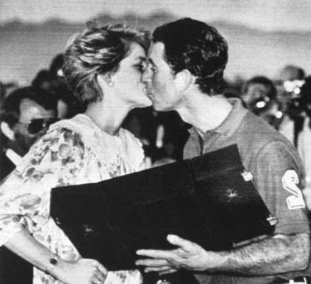 Princess Diana kisses Prince Charles after giving him his runners up prize at a Polo match at the Royal Oman Polo Ground, November 12, 1986. REUTERS/Nick Didlick