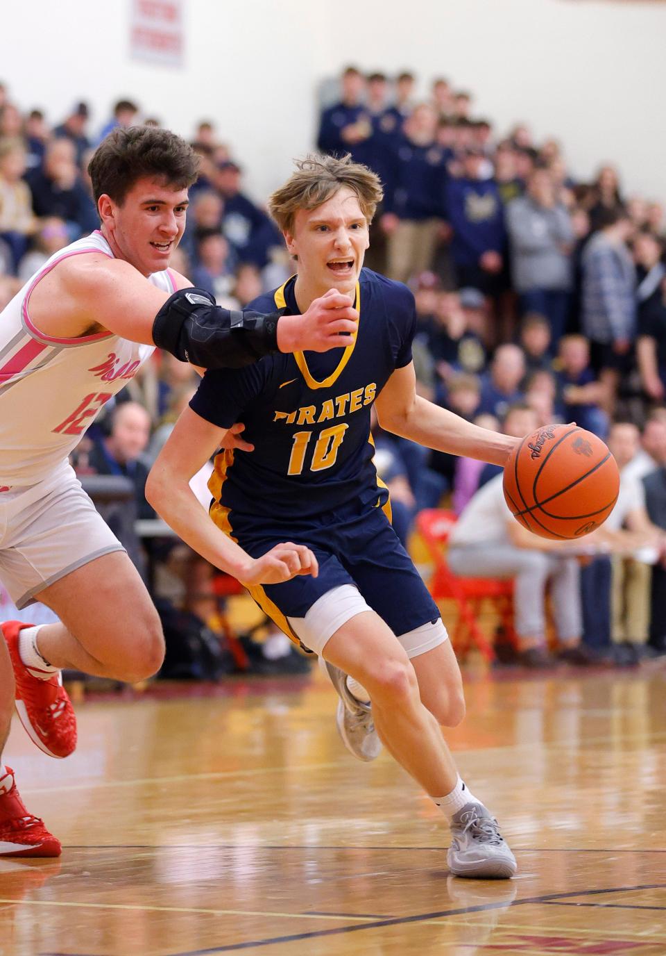 Pewamo-Westphalia's Grady Eklund, right, drives against Laingsburg's Ty Randall, Tuesday, Jan. 23, 2024, in Laingsburg.