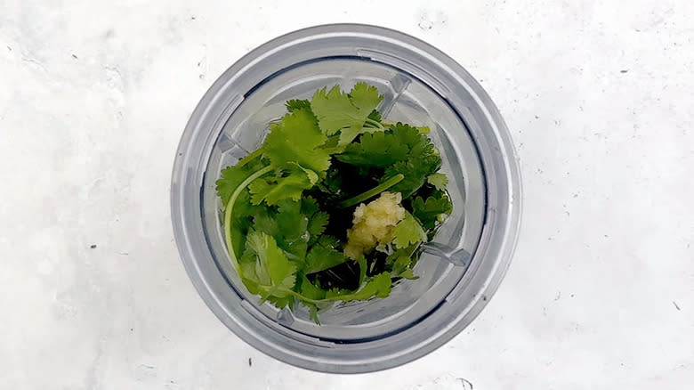 cilantro, olive oil, lime juice, garlic, honey in blender bowl