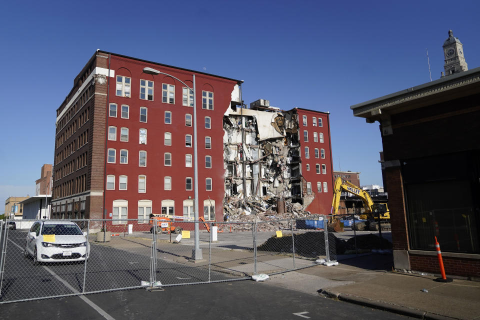 An apartment building that partially collapsed two days earlier is seen, Tuesday, May 30, 2023, in Davenport, Iowa. Five residents of the six-story apartment building remained unaccounted for and authorities feared at least two of them might be stuck inside rubble that was too dangerous to search. (AP Photo/Erin Hooley)