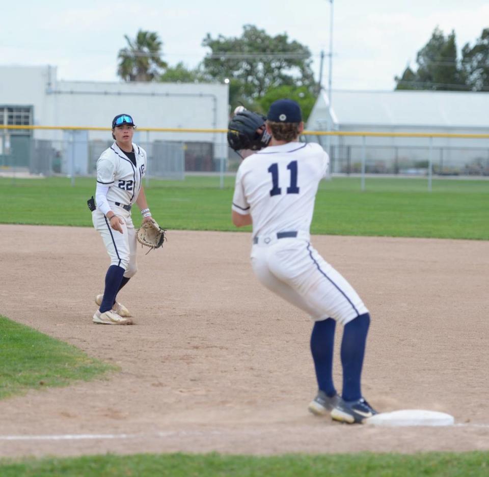 Central Catholic first baseman Kayden McHenry flips the ball to pitcher TP Wentworth for an out during a Valley Oak League matchup with Manteca at Manteca High School on Friday, April 26, 2024.