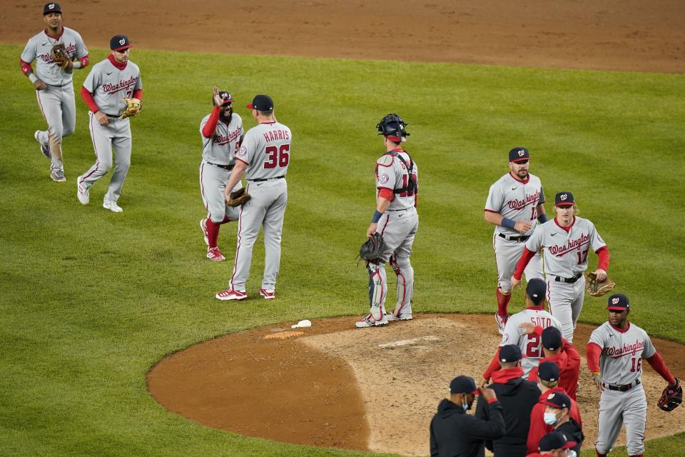 The Washington Nationals celebrate after a baseball game against the New York Yankees, Friday, May 7, 2021, in New York. (AP Photo/Frank Franklin II)