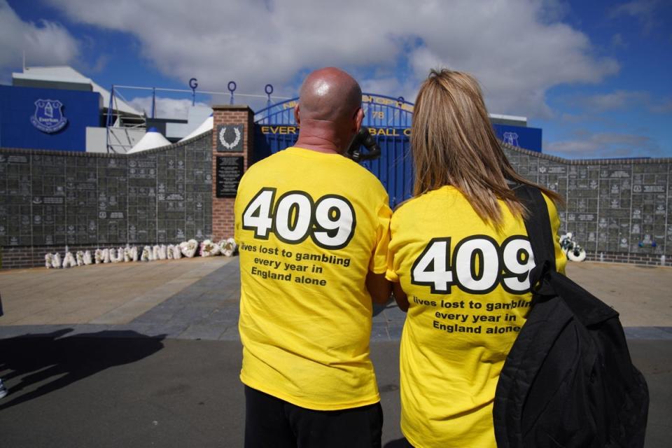 Families of gambling addict suicide victims outside Everton Football Club (Peter Byrne/PA) (PA Wire)