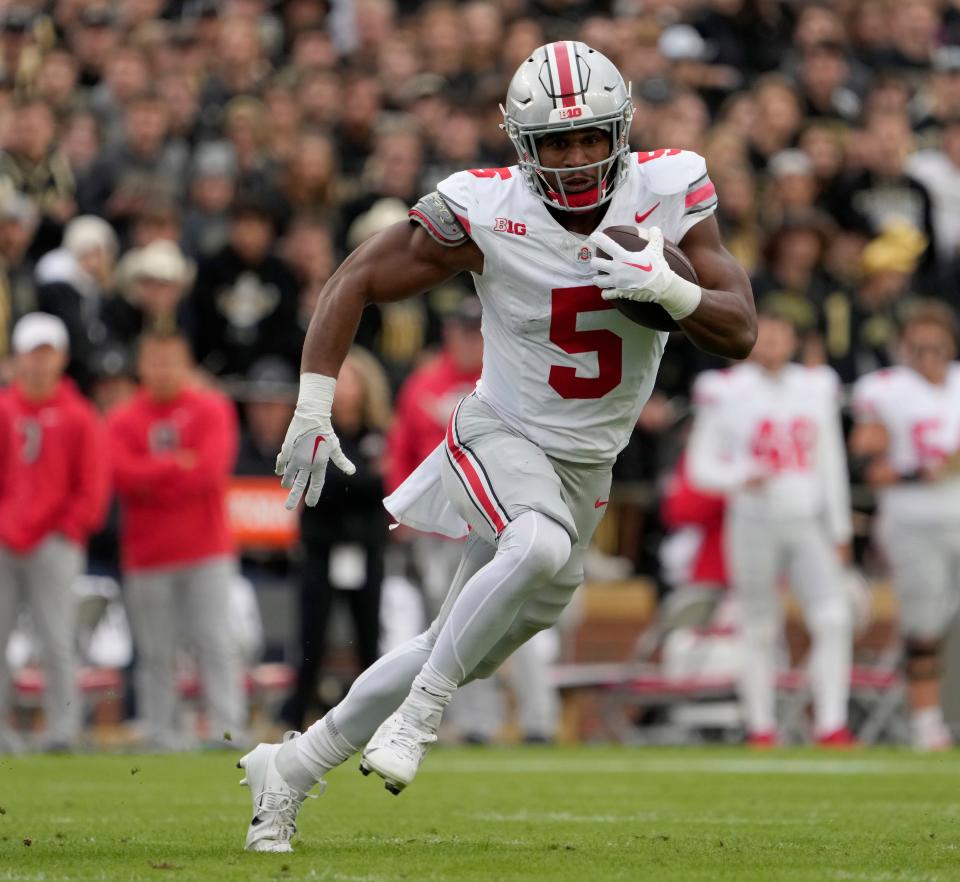 Oct. 14, 2023; Lafayette, In., USA; 
Ohio State Buckeyes running back Dallan Hayden (5) runs the football during the first half of Saturday's NCAA Division I football game against the Purdue Boilermakers at Ross-Ade Stadium in Lafayette.