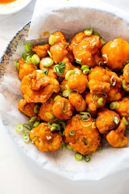 <p>Grandbaby Cakes</p><p>This Spicy Buffalo Fried Cauliflower starts with fresh cauliflower florets that are buttermilk marinated then fried to golden brown perfection and finally tossed in a spicy buffalo sauce.</p><p><strong>Get the recipe: </strong><strong><a href="https://grandbaby-cakes.com/buffalo-fried-cauliflower/" rel="nofollow noopener" target="_blank" data-ylk="slk:Buffalo Fried Cauliflower;elm:context_link;itc:0;sec:content-canvas" class="link ">Buffalo Fried Cauliflower</a></strong></p>