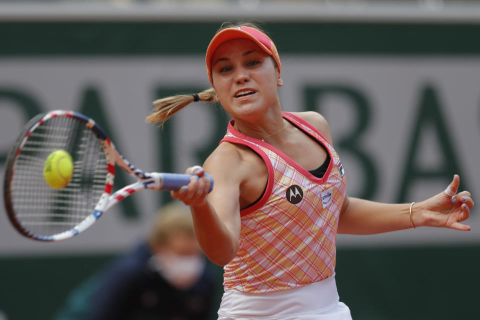 File - In this Oct. 10, 2020, file photo, Sofia Kenin, of the United States, plays a shot against Poland's Iga Swiatek in the final match of the French Open tennis tournament at the Roland Garros stadium in Paris, France. Kenin is the top-seeded woman in Abu Dhabi, where the first women’s tour-level tennis event of 2021 begins main-draw play on Wednesday, Jan. 6, 2021. (AP Photo/Michel Euler, File)