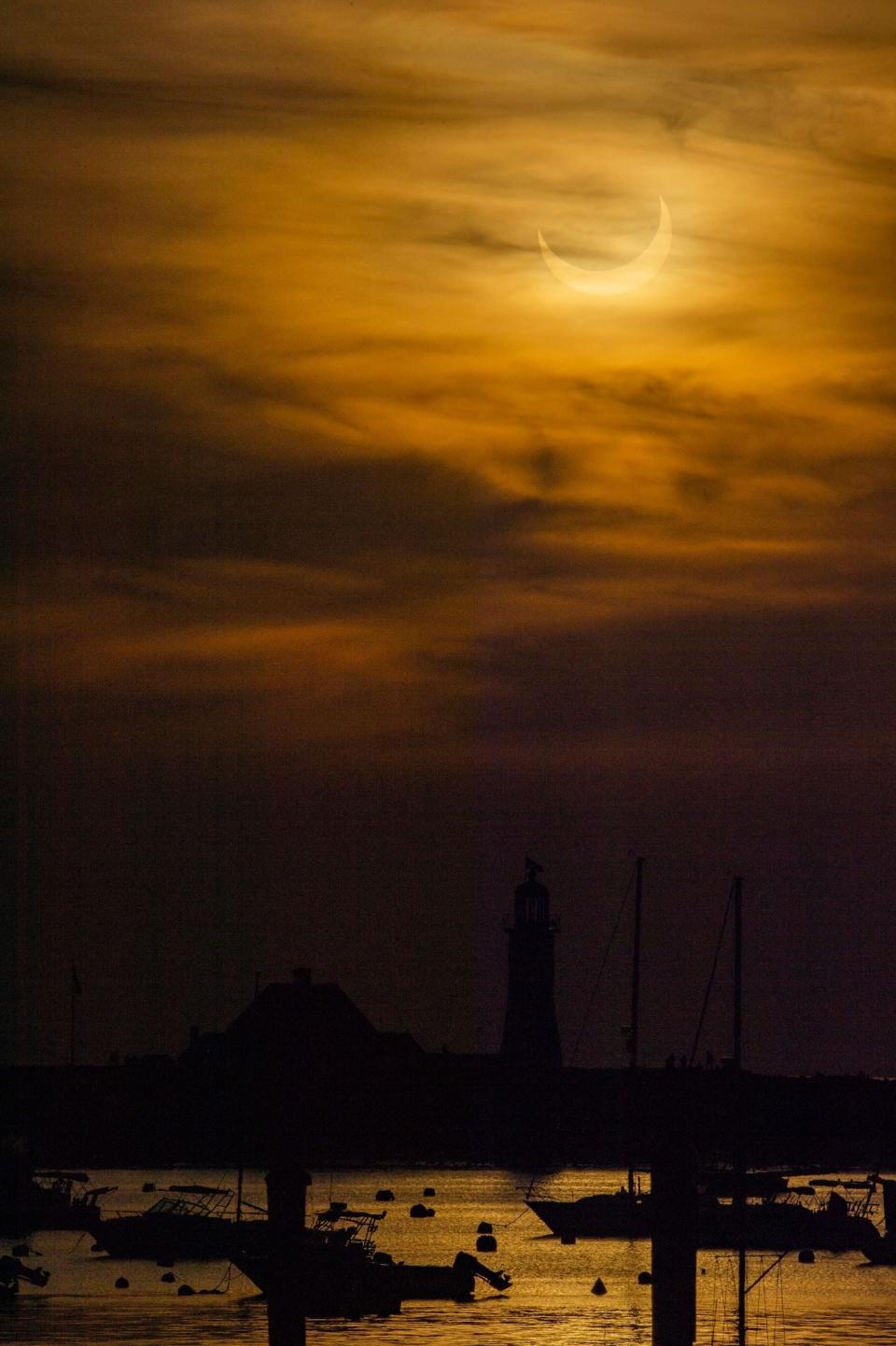 Sun rise over Scituate Light, Scituate, Massachusetts (AFP via Getty Images)