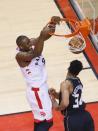 May 25, 2019; Toronto, Ontario, CAN; Toronto Raptors forward Serge Ibaka (9) dunks against Milwaukee Bucks forward Giannis Antetokounmpo (34) during the first half of game six of the Eastern conference finals of the 2019 NBA Playoffs at Scotiabank Arena. John E. Sokolowski-USA TODAY Sports