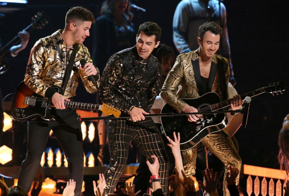 Nick Jonas, from left, Joe Jonas, and Kevin Jonas, of the Jonas Brothers, perform at the 62nd annual Grammy Awards on Sunday, Jan. 26, 2020, in Los Angeles.