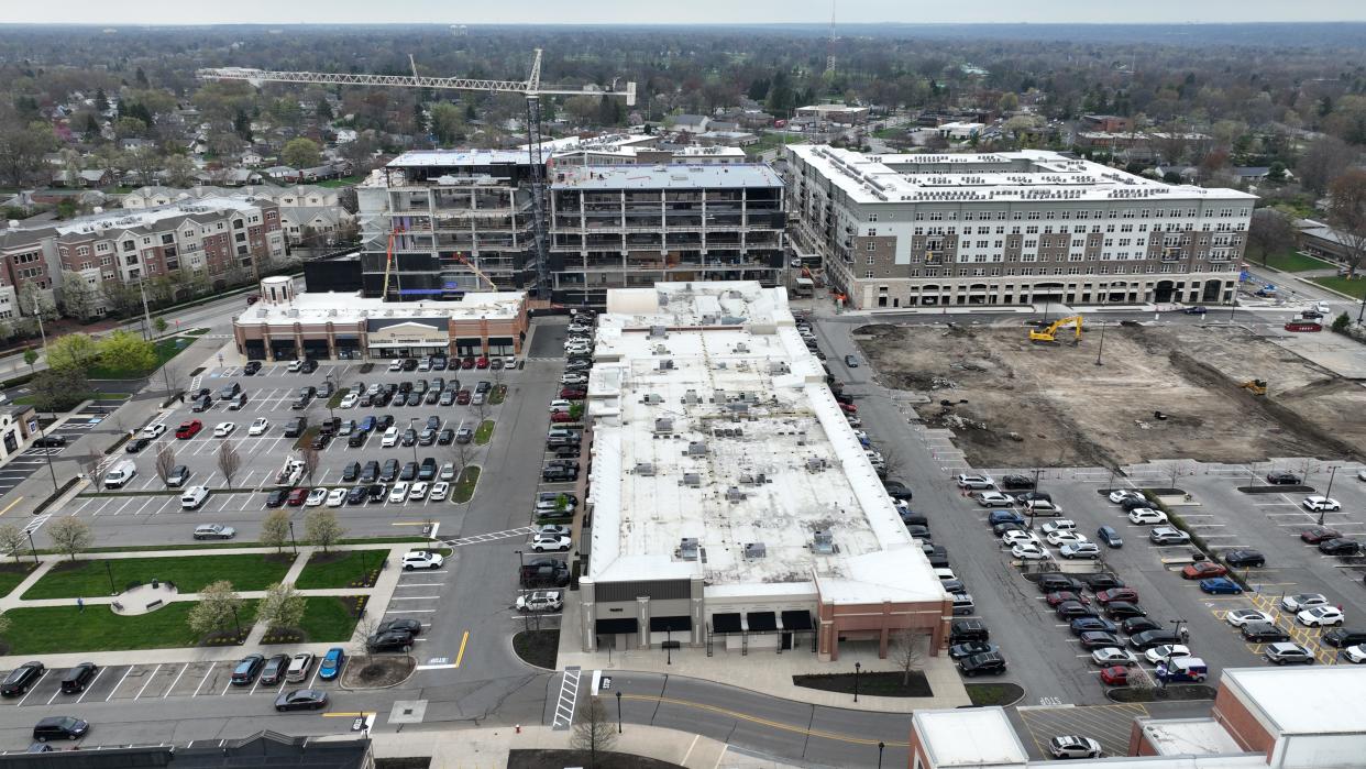 The multistory Bob Crane Community Center is under construction in the upper left part of the Kingsdale Shopping Center in Upper Arlington. A parking garage is planned for the construction site at the right.