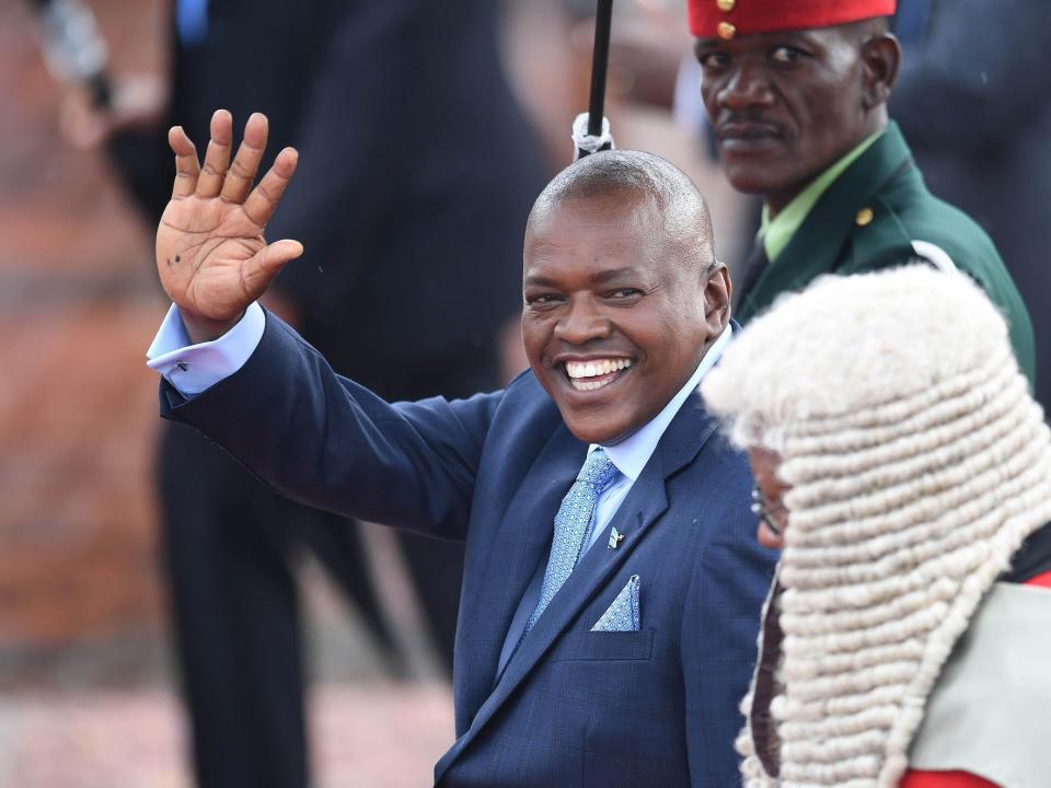 Botswana's President Mokgweetsi Masisi (L) waves after taking the oath as the 5th President at the National Assembly in Gaborone on 1 April 2018.