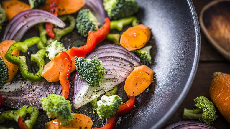 Onions, peppers, and broccoli on plate
