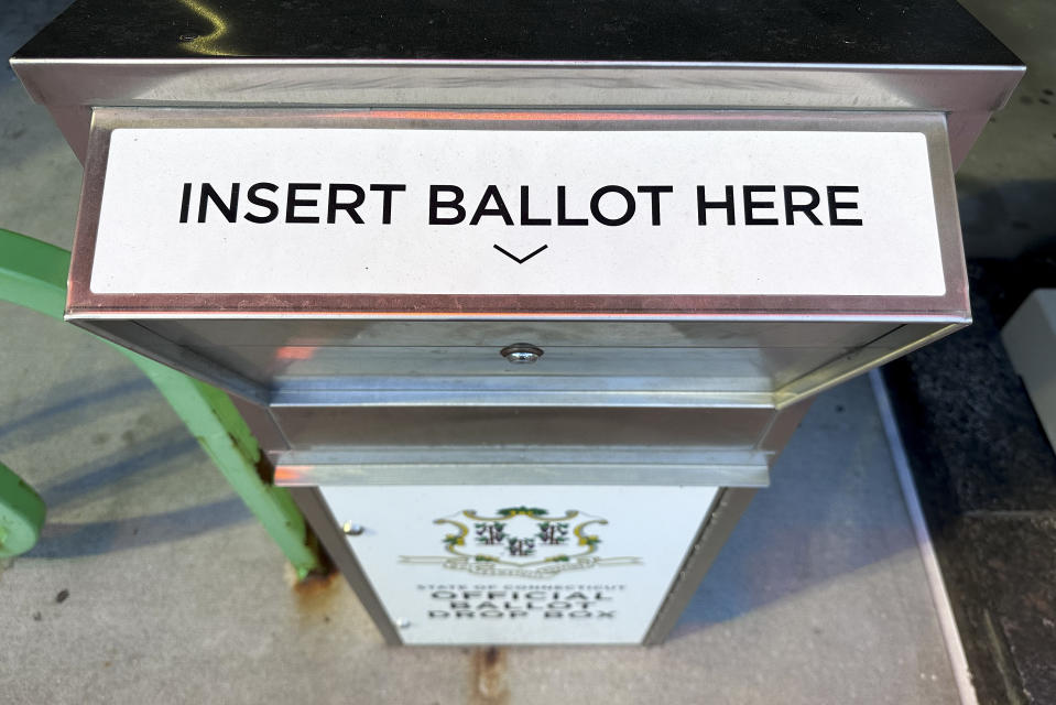 A ballot drop box sits outside the city government center, Thursday, Oct. 5, 2023, in Bridgeport, Conn. Ballot drop boxes have been a prime target for those pushing conspiracy theories that the 2020 presidential race was rigged and election results can't be trusted. While the narrative is false, Democrats in Connecticut's largest city are unwittingly fueling the claims as two candidates for mayor trade accusations that each side stuffed drop boxes with bogus ballots. (AP Photo/Julie Jacobson)