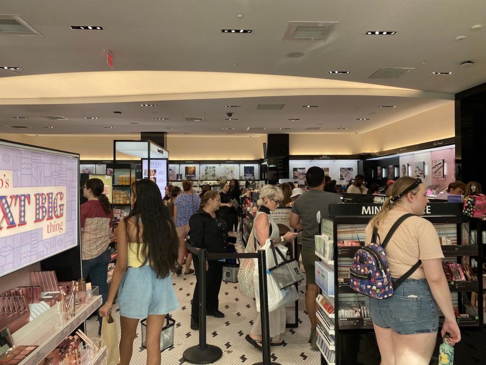 A large crowd of shoppers at Sephora in Disney Springs.