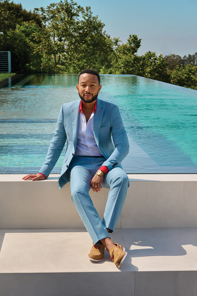 John Legend wears a Burberry suit, Gucci shirt and Sperry shoes. - Credit: Yu Tsai