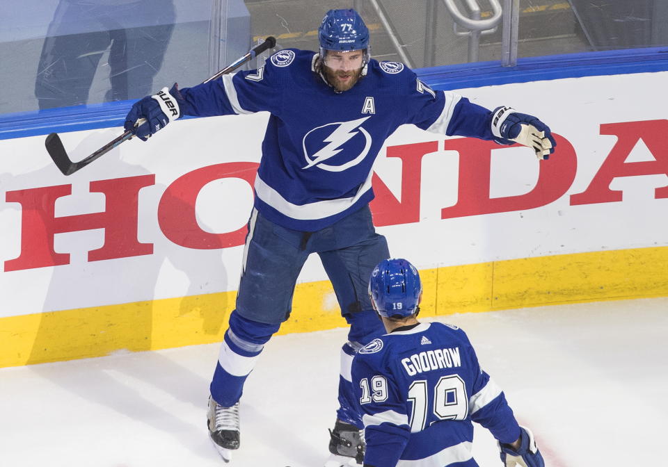 Tampa Bay Lightning defenseman Victor Hedman (77) celebrates his goal against the New York Islanders with Barclay Goodrow (19) during the second period of Game 5 of the NHL hockey Eastern Conference final, Tuesday, Sept. 15, 2020, in Edmonton, Alberta. (Jason Franson/The Canadian Press via AP)