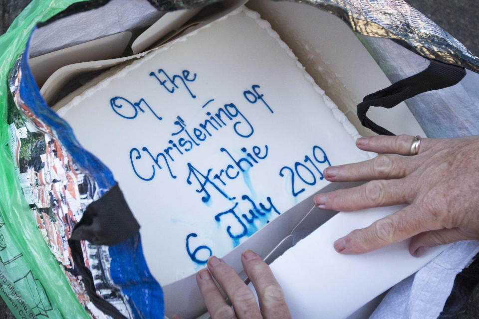 A cake from a royal well-wisher outside Windsor Castle in celebration of the royal christening of the Duke and Duchess of Sussex's son, Archie, in the castle's intimate private chapel. RESS ASSOCIATION Photo. Picture date: Saturday July 6, 2019. See PA story ROYAL Christening. Photo credit should read: Rick Findler/PA Wire