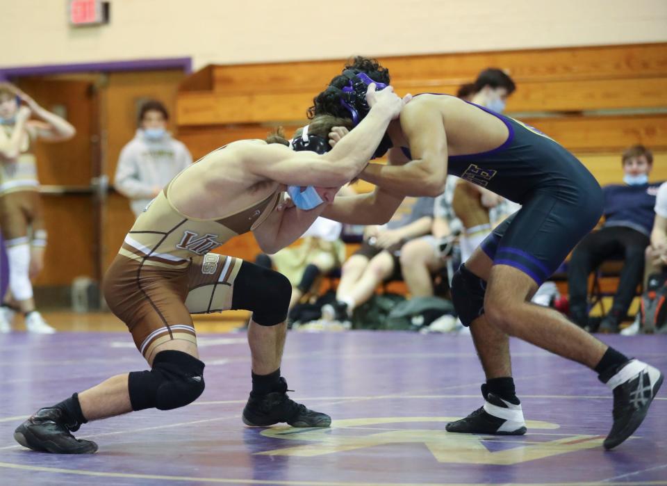 Clarkstown South's Justin Termine defeats Clarkstown North's Rcey Ortega in a 126-pound match during a dual meet at Clarkstown North High School in New City on Thursday, January 27, 2022.  Clarkstown South won the meet 41-30.