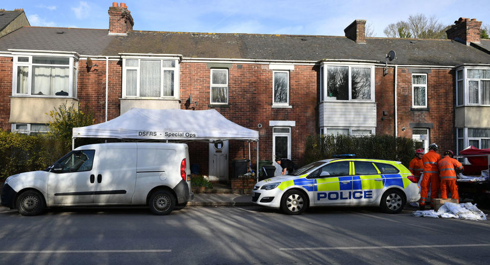 Members of Fire and Rescue erect a gazebo outside an address in Exeter where the body of a man aged 80 was found on Monday afternoon. (Pic: PA)exet