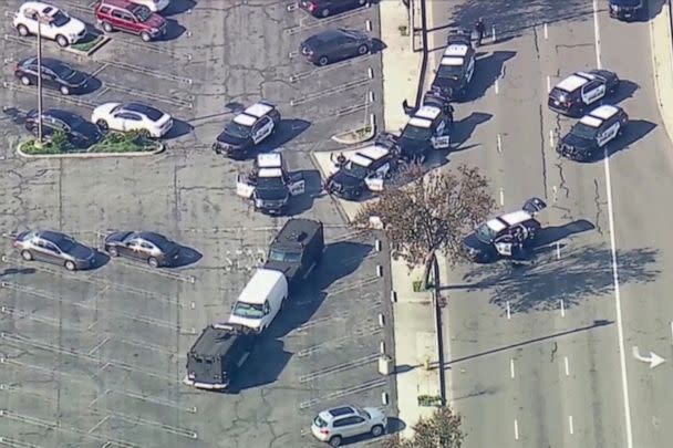 PHOTO: Police use armored vehicles to surround a white cargo van, believed by law enforcement to be connected to the Monterey Park shooting suspect according to an ABC affiliate, at a parking lot in Torrance, Calif., Jan. 22, 2023 in a video screengrab. (Abc Affiliate KABC via Reuters)