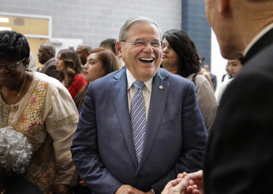 New Jersey Sen. Bob Menendez talks with people at a ribbon cutting ceremony at Essex County Donald M. Payne, Sr. School of Technology in Newark, N.J., Monday, June 4, 2018. With the opportunity for at least two pickups, Democrats' road to controlling any part of Congress could cut through New Jersey this fall — but first primary voters will have their say. Incumbents face challenges in the Senate contest, where Democrat Menendez will face a well-funded former pharmaceutical executive, if both survive the primary. (AP Photo/Seth Wenig)