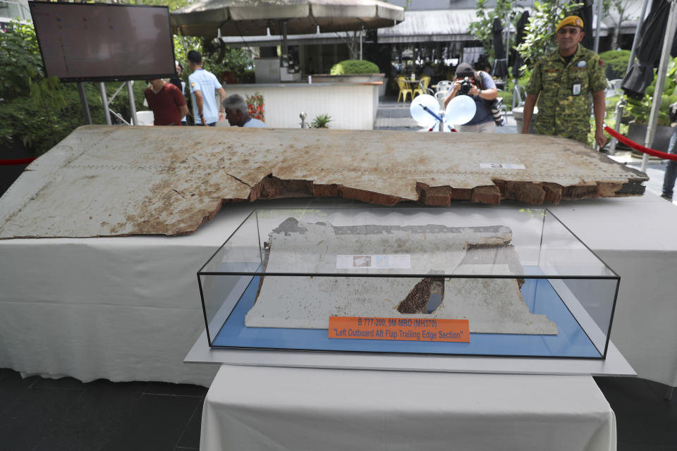 FILE - Debris from the missing Malaysia Airlines Flight MH370 is displayed during a Day of Remembrance for MH370 event in Kuala Lumpur, Malaysia, on March 3, 2019. A decade ago this week, a Malaysia Airlines flight vanished without a trace to become one of aviation’s biggest mystery. Investigators still do not know exactly what happened to the plane and its 239 passengers. (AP Photo/Vincent Thian, File)