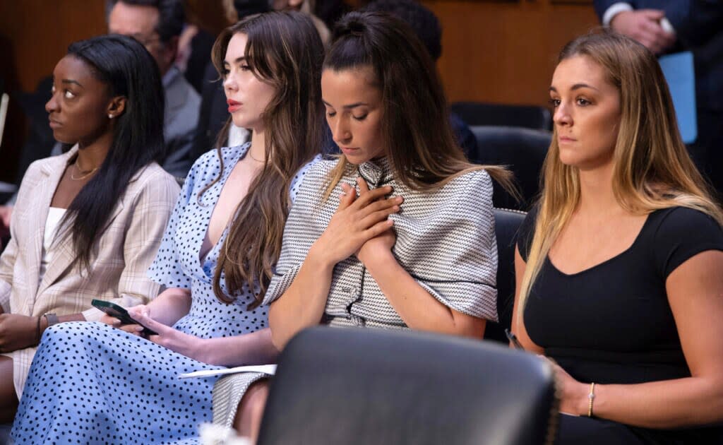 FILE – United States gymnasts from left, Simone Biles, McKayla Maroney, Aly Raisman and Maggie Nichols, arrive to testify during a Senate Judiciary hearing about the Inspector General’s report on the FBI’s handling of the Larry Nassar investigation on Capitol Hill, Wednesday, Sept. 15, 2021, in Washington. Olympic gold medalist Simone Biles and dozens of other women who say they were sexually assaulted by Larry Nassar are seeking more than $1 billion from the FBI for failing to stop the now convicted sports doctor when the agency first received allegations against him, lawyers said Wednesday, June 8, 2022. (Saul Loeb/Pool via AP, File)