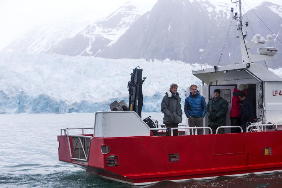 FILE - U.S. Secretary of State John Kerry and Norwegian Foreign Minister Borge Brende tour the Blomstrand Glacier, June 16, 2016, in Ny-Alesund, Norway. Kerry visited to view areas impacted by climate change with melting ice and the opening of new sea lanes. (AP Photo/Evan Vucci, Pool, File)